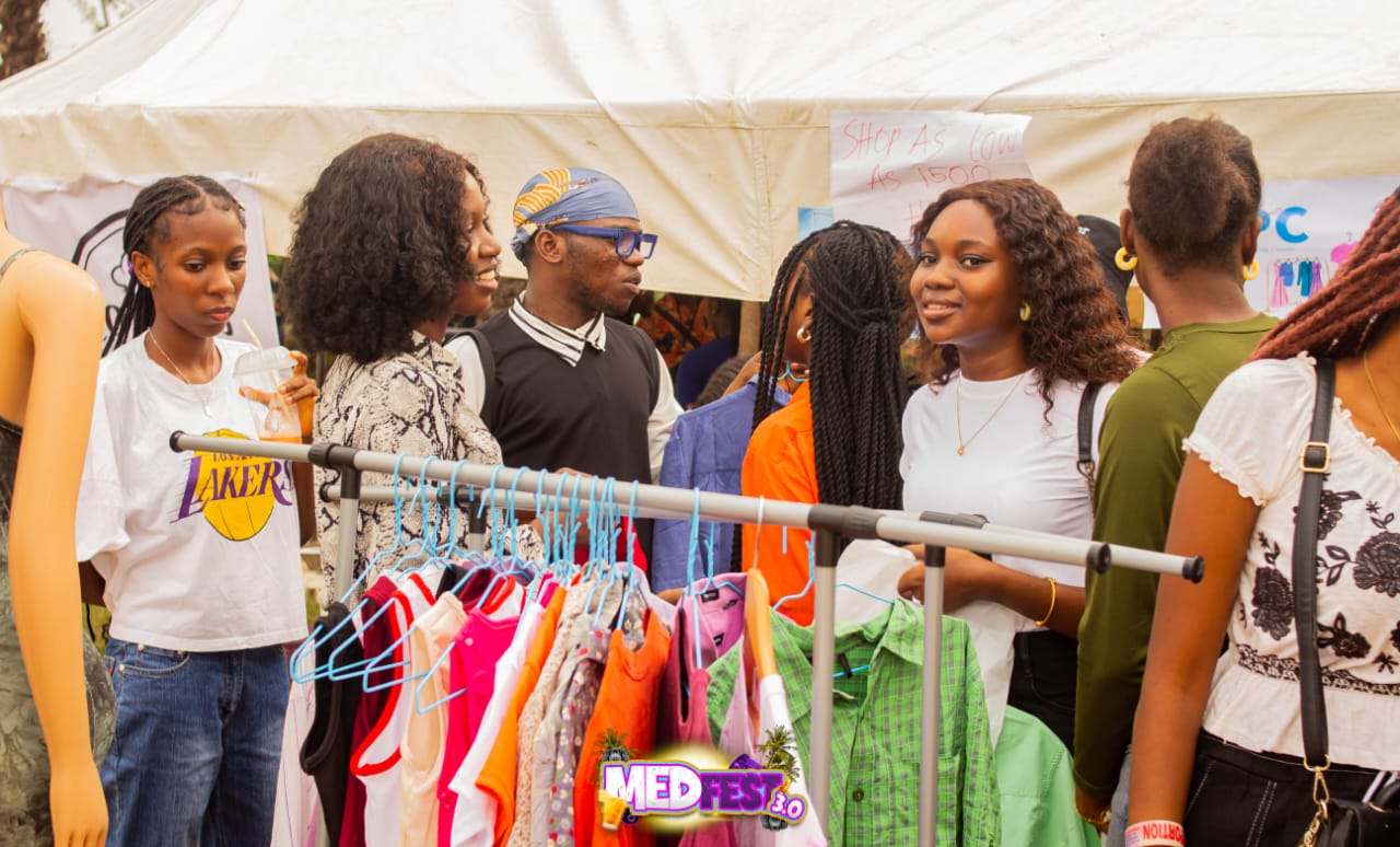 Shoppers browsing a clothing rail at MedFest 3